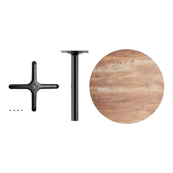 A round wooden table with a black metal base.