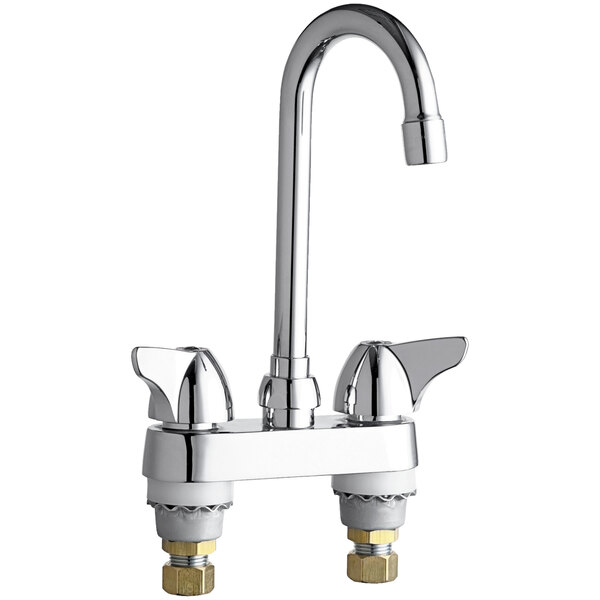 A chrome Chicago Faucets deck-mounted faucet with two handles.