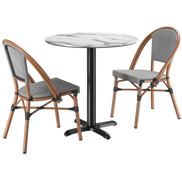 A Lancaster Table & Seating Versilla round table with two French bistro chairs.