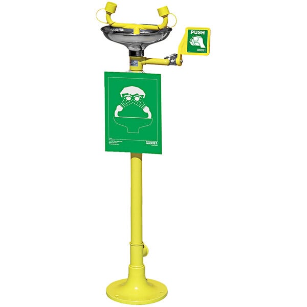 A green and yellow push-up sign with a green frog and text reading "Eye Wash" above a white background.