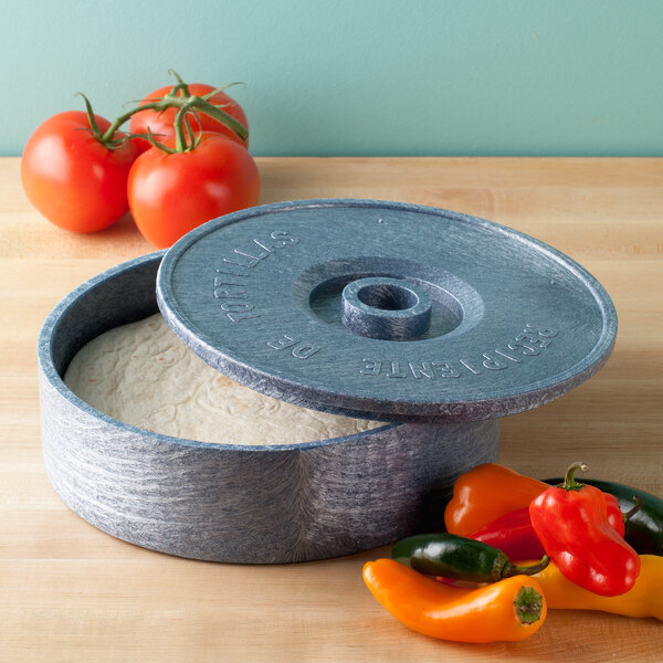 A round blue HS Inc. Polyethylene tortilla server with a round lid on it.