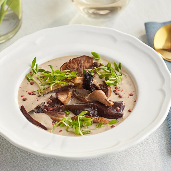 A white plate with a bowl of Dried Forest Blend Mushrooms.