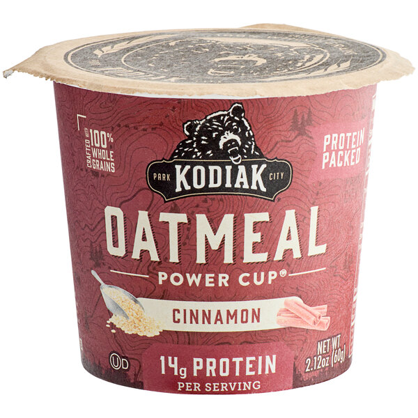 A red and white container of Kodiak Cakes Cinnamon Oatmeal Cup.