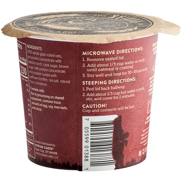 A red Kodiak Cakes Cinnamon Oatmeal cup with a label on it.