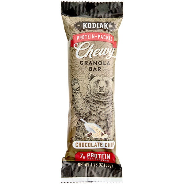 A white package of Kodiak Cakes Chocolate Chip Chewy Granola Bars with brown and white food inside.