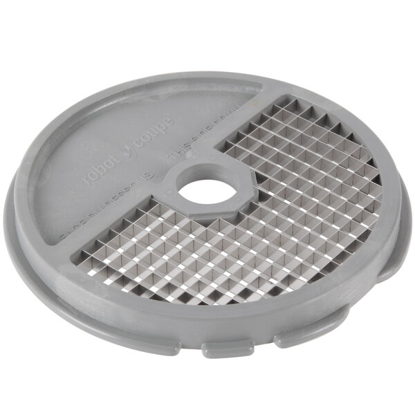 A grey circular Robot Coupe dicing kit with small grids on top.