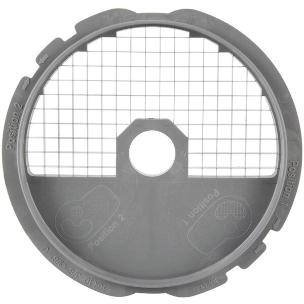 A gray circular Robot Coupe dicing kit with grids.