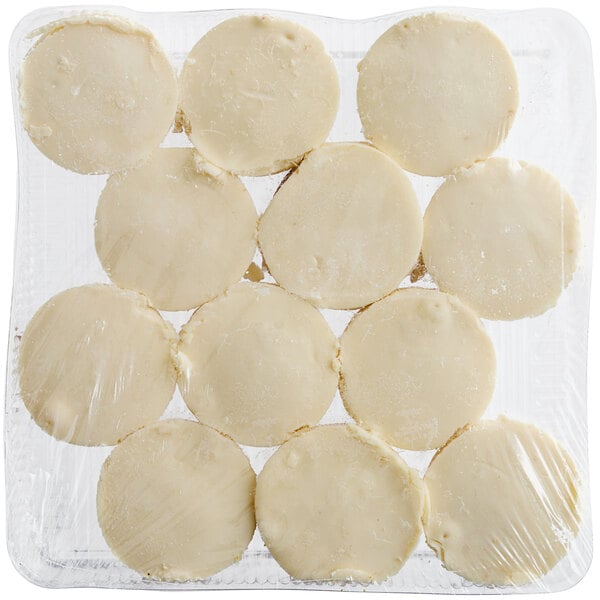 A plastic container with Tennessee Cheesecake Petite Original Cheesecakes inside.