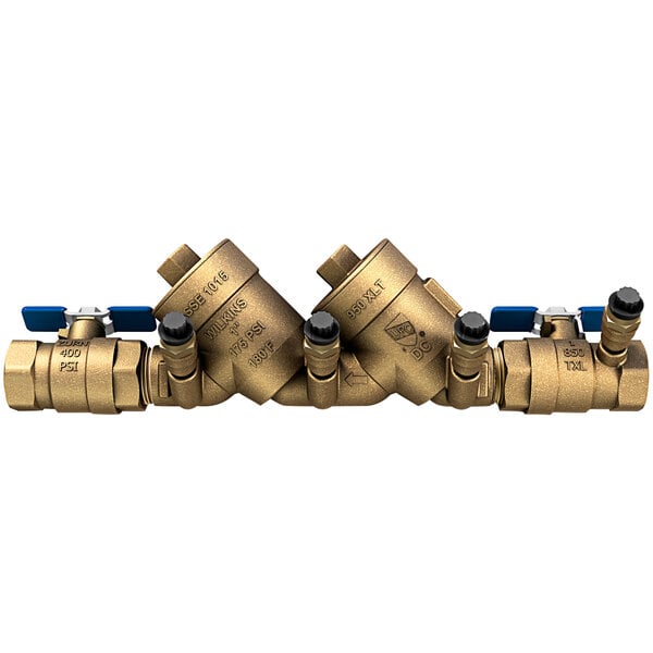 A Zurn 1" backflow preventer with three brass ball valves.