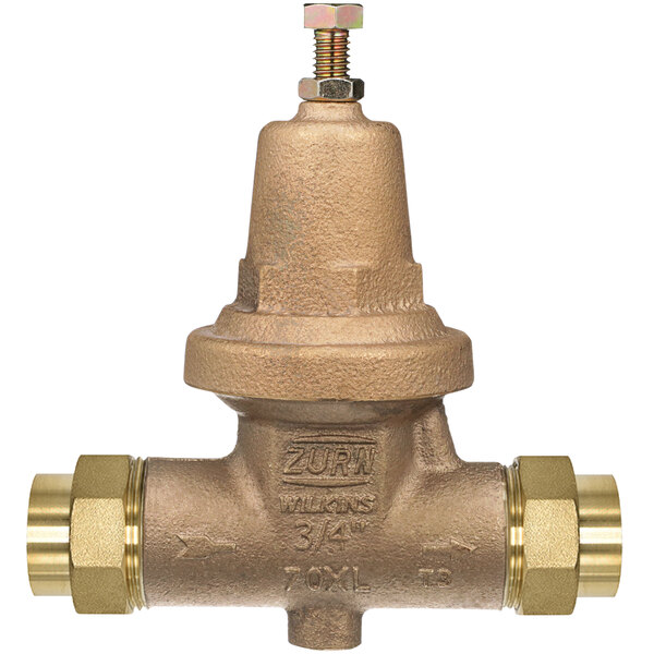 A Zurn brass water pressure reducing valve with double union connections.