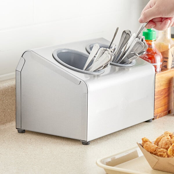 Steril-Sil stainless steel flatware in a countertop container.