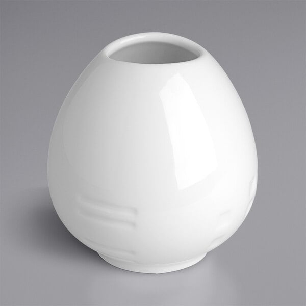 A white round RAK Porcelain Ivoris vase with a hole in the middle.