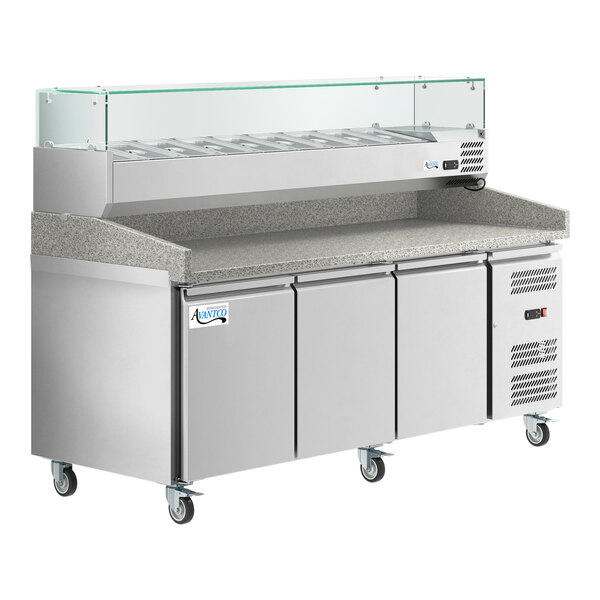 An Avantco stainless steel refrigerated pizza prep table with a stone top and refrigerated topping rail.