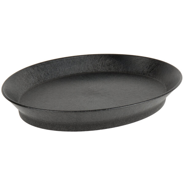 A black oval deli server with a short base on a counter.