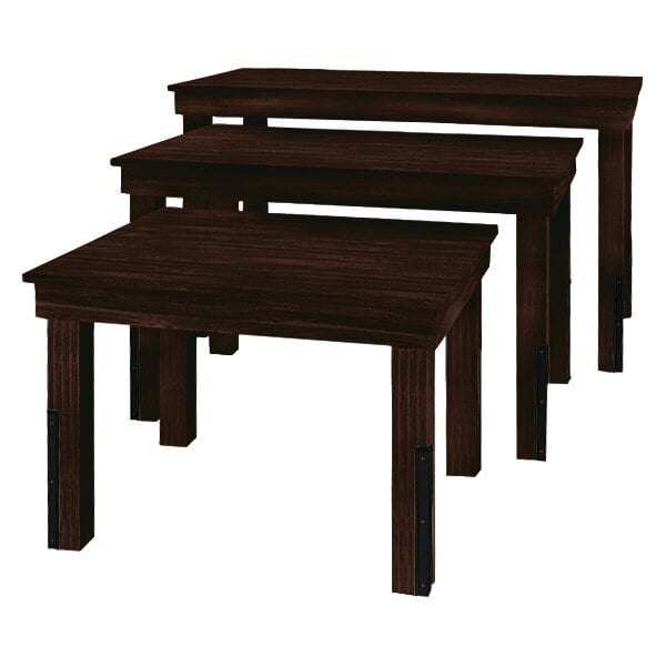 A Marco Company three-piece nesting display table set with dark wood tops and legs.