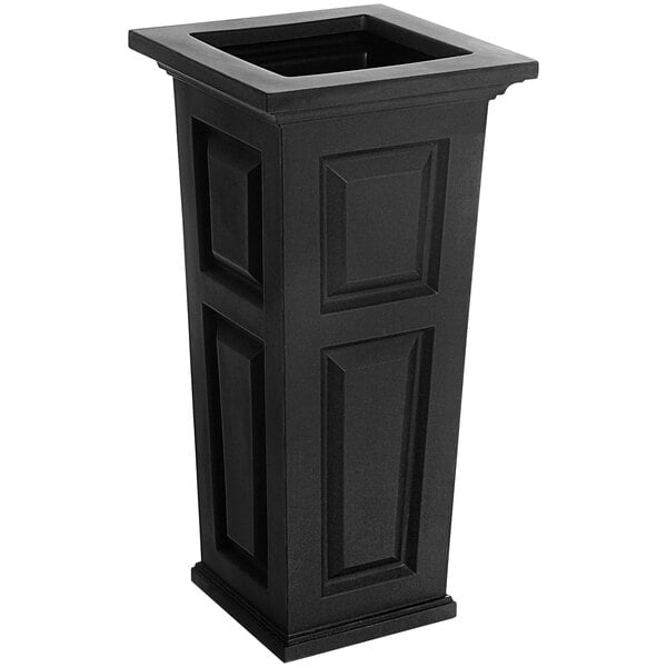 A black rectangular planter with square designs on the top.
