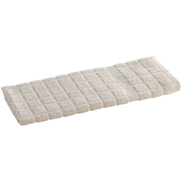 An Oxford Kitchen Ensemble beige kitchen towel with a checkered pattern.