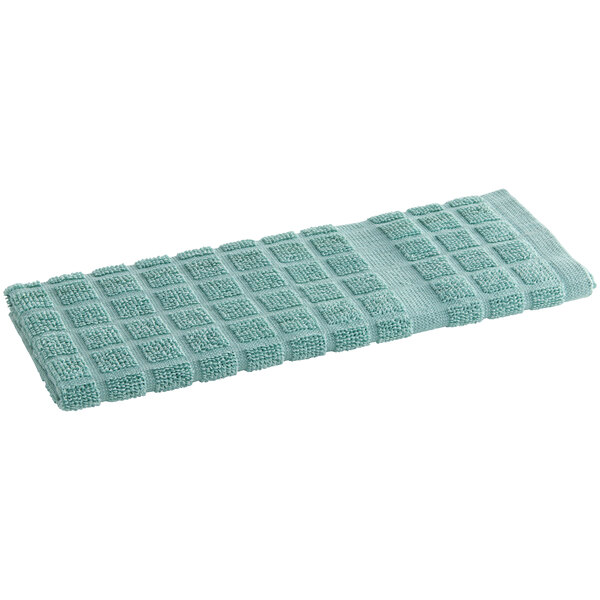 A green Oxford Kitchen Ensemble kitchen towel.