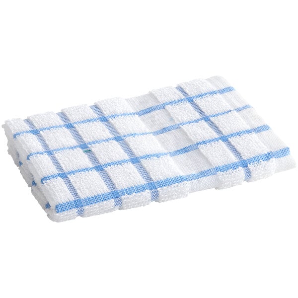 A folded white dish cloth with blue windowpane stripes.