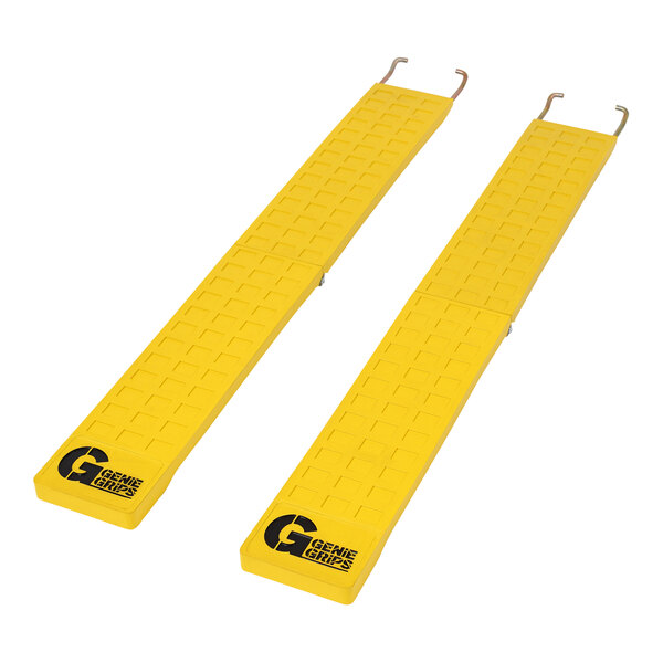 Two yellow GenieGrips mats with black text on them.