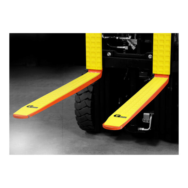 A forklift with a couple of yellow GenieGrips pads on the forks.