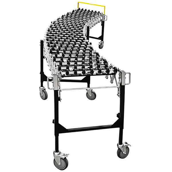 A silver metal roller conveyor with black wheels.