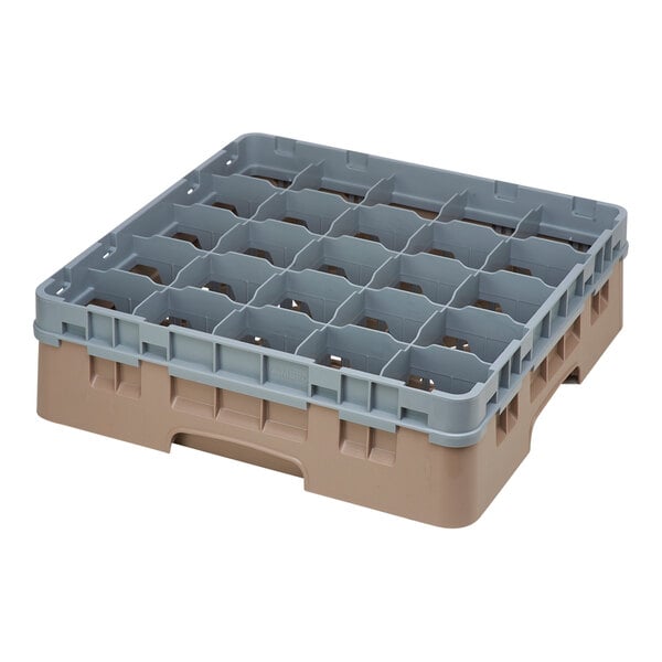 A beige plastic Cambro glass rack with many compartments and an extender.