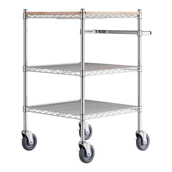 A Regency chrome utility cart with three shelves and wheels.