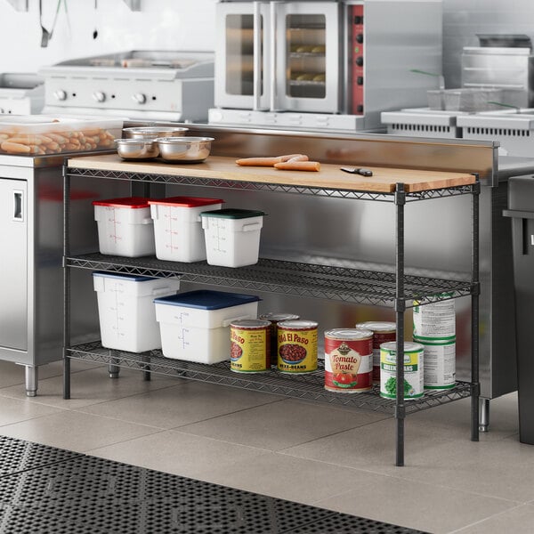 A kitchen with a counter and Regency black epoxy shelves.