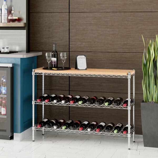 A Regency chrome wire wine rack with wooden shelf inserts holding wine bottles.