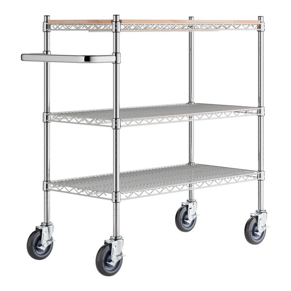 A chrome Regency utility cart with three shelves and wheels.