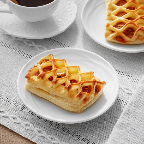 A plate with two pieces of Bridor Tomato Olive Bistro pastries.