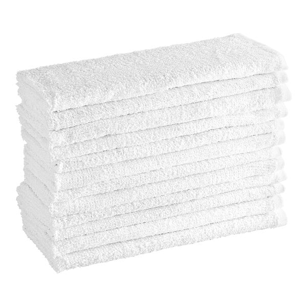 A stack of twelve folded white textured towels.