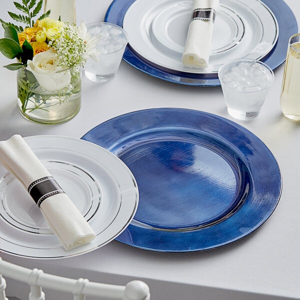 Full table setting with blue charger plates