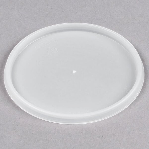 A Dart translucent plastic lid with a white circle.