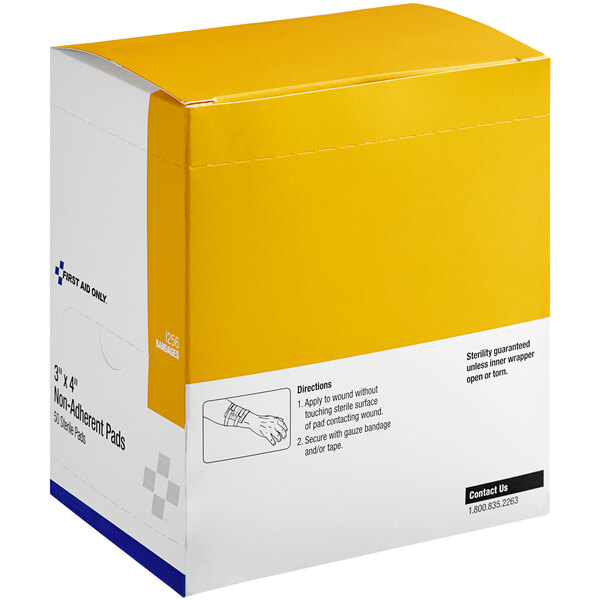 A yellow and white First Aid Only box of 50 sterile pads with a white label and black text.