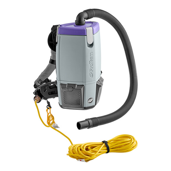 A ProTeam backpack vacuum with a hose attached and a cord.
