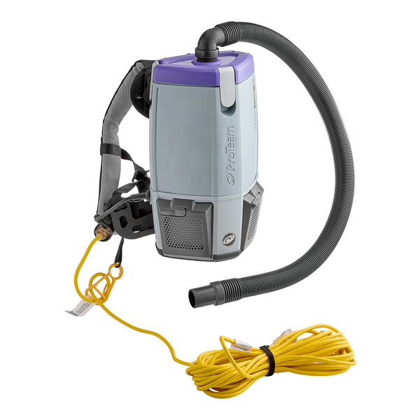A ProTeam backpack vacuum with a hose and cord attached.