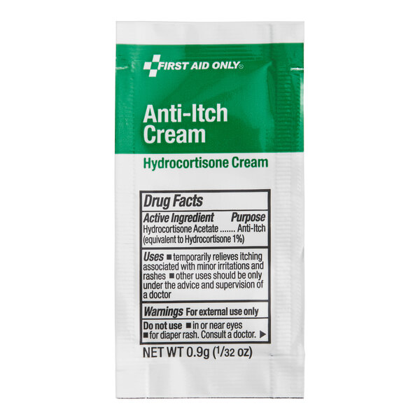 A close-up of a green and white First Aid Only Hydrocortisone 1% Anti-Itch Cream packet.