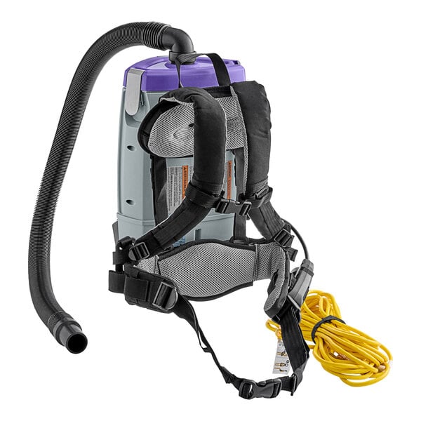 A ProTeam backpack vacuum cleaner with a hose attached.