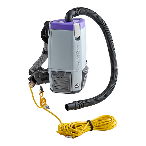 A ProTeam backpack vacuum with a hose attached.