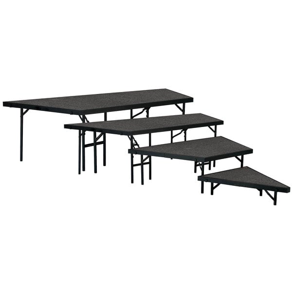 A black rectangular table with National Public Seating stage pie unit on it.