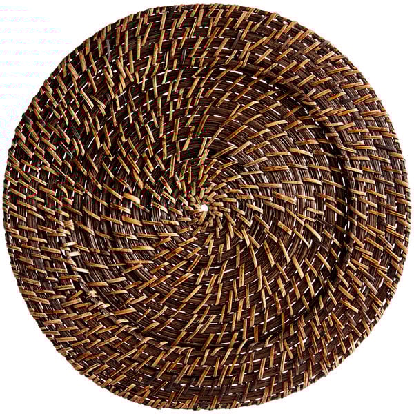 A round wicker Acopa charger plate with a spiral pattern.