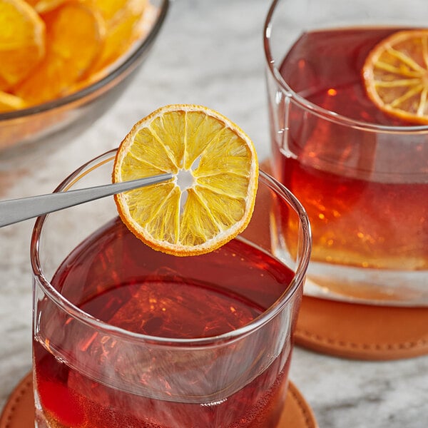 A close up of a bowl of dried clementine orange slices.