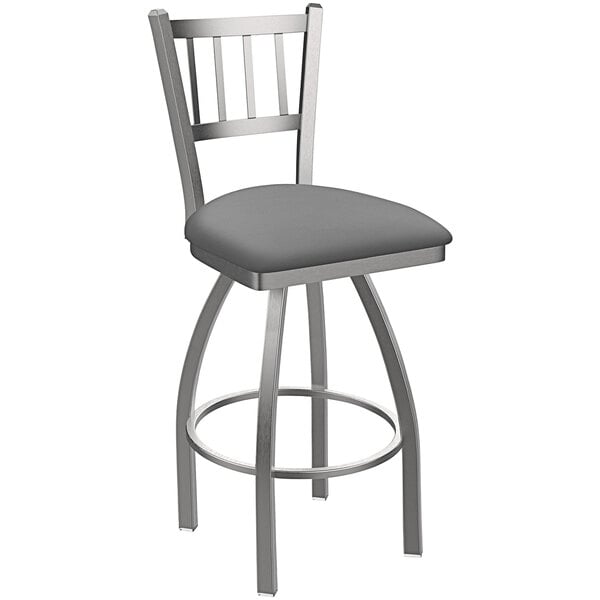 A Holland Bar Stool stainless steel slat back swivel bar stool with a gray seat and back.