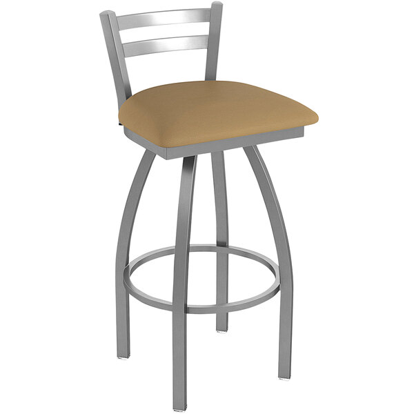 A Holland Bar Stool outdoor bar stool with a beige cushion and stainless steel legs.