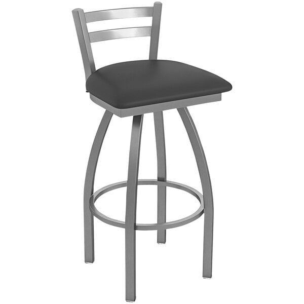 A black and stainless steel Holland Bar Stool outdoor counter stool with a black cushion.