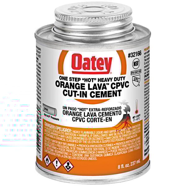 An orange and white can of Oatey CPVC orange lava cement with a black and orange logo.