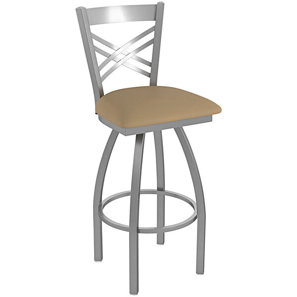 A Holland Bar Stool outdoor swivel bar stool with a beige cushion with a crossback.