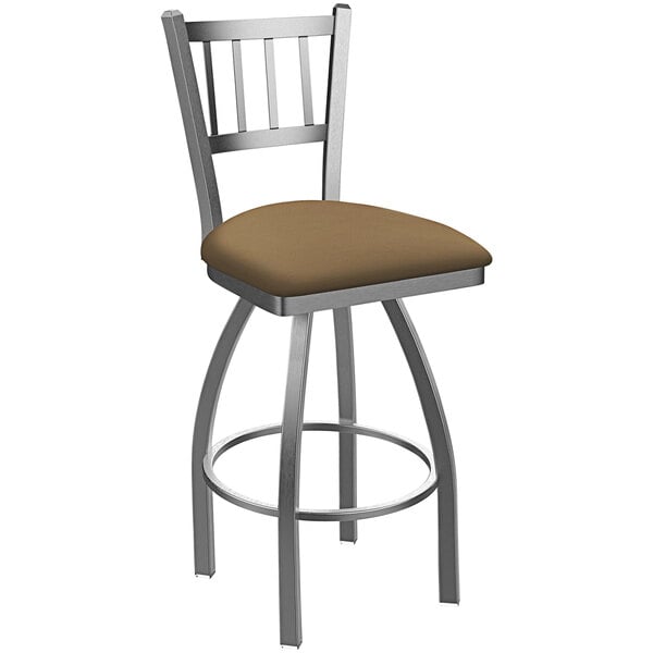 A Holland Bar Stool outdoor extra tall bar stool with a slat back and brown cushion.